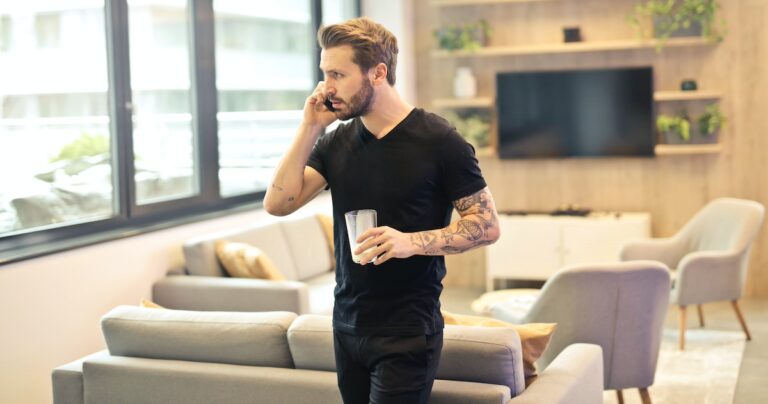 IVR scripts: image of a man standing while listening to an IVR exchange